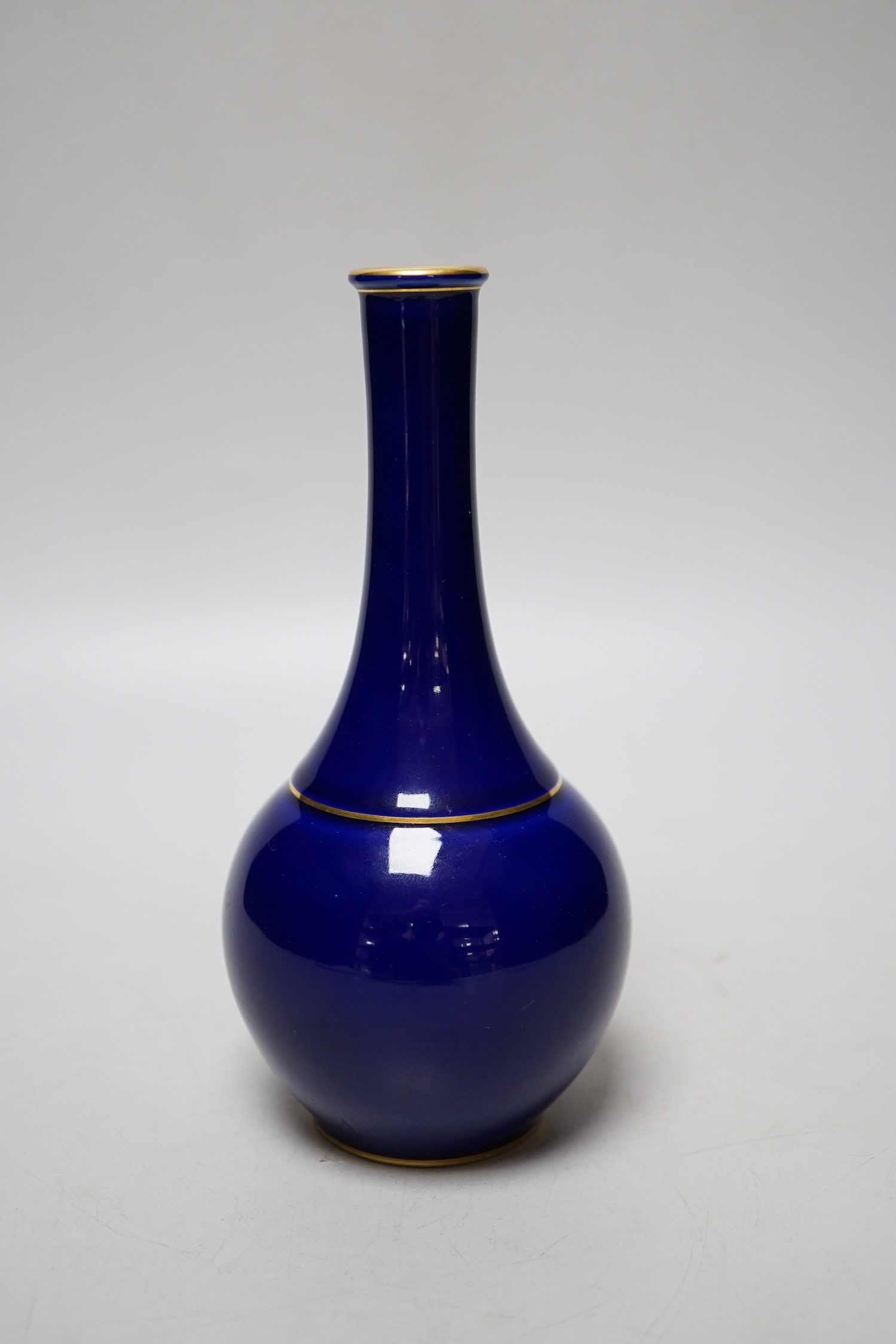 A Sevres blue glazed bottle vase, date code for 1924, 17cm